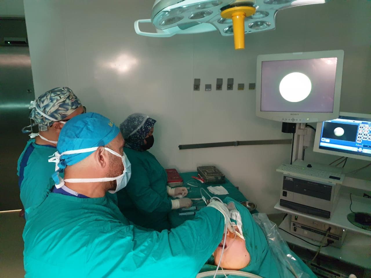 Mr Anwar operating in theatre with his surgical team